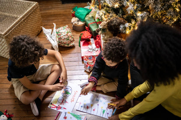istock Siblings drawing for Christmas at home 1345490836