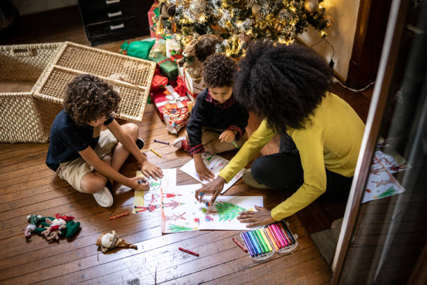 istock Siblings drawing for Christmas at home 1345490850