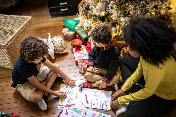istock Siblings drawing for Christmas at home 1345490974