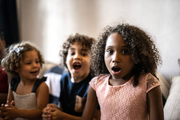 istock Surprised kids on Christmas Day at home 1345491024