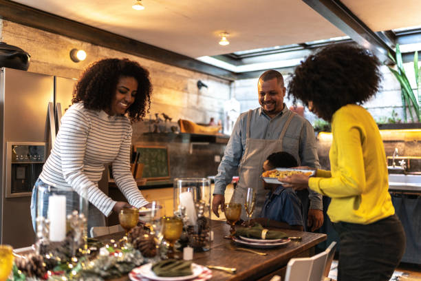 istock Family setting table for lunch/dinner or Christmas at home 1345491370