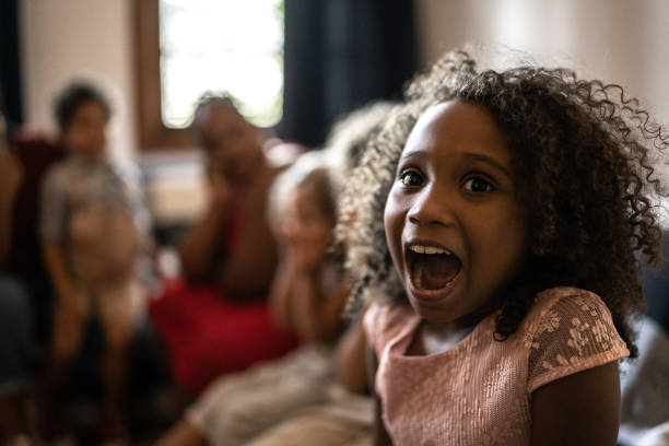 istock Surprised kids on Christmas Day (or watching tv) at home 1345491403