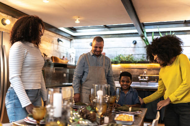 istock Family setting table for lunch/dinner or Christmas at home 1345491485