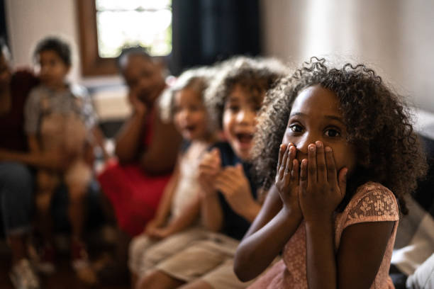 istock Surprised kids on Christmas Day (or watching tv) at home 1345491588
