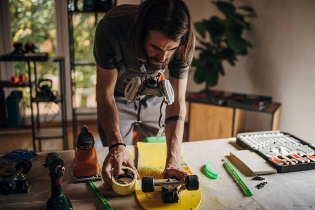 istock Skater repairing his skateboard 1345494274