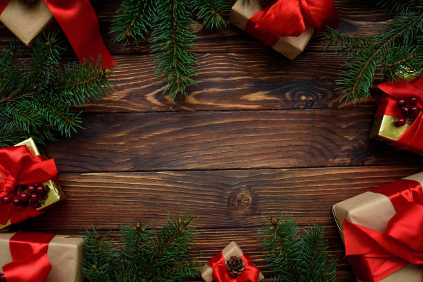 istock Christmas background with decorations and gift boxes on wooden table. Top view. Copy space.  Merry christmas and happy new year 1345494807