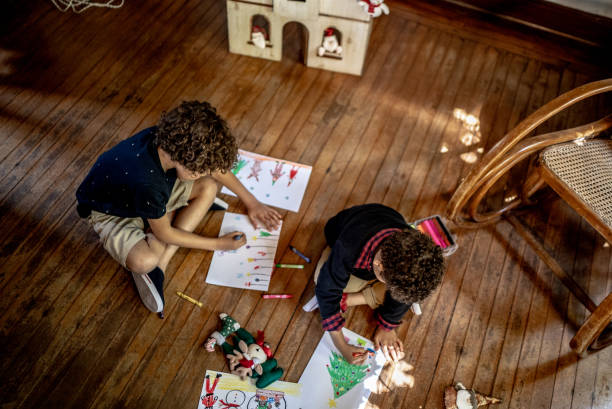 istock Brothers drawing together at home 1345495071