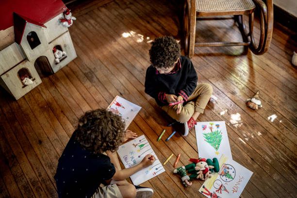 istock Brothers drawing together at home 1345495578