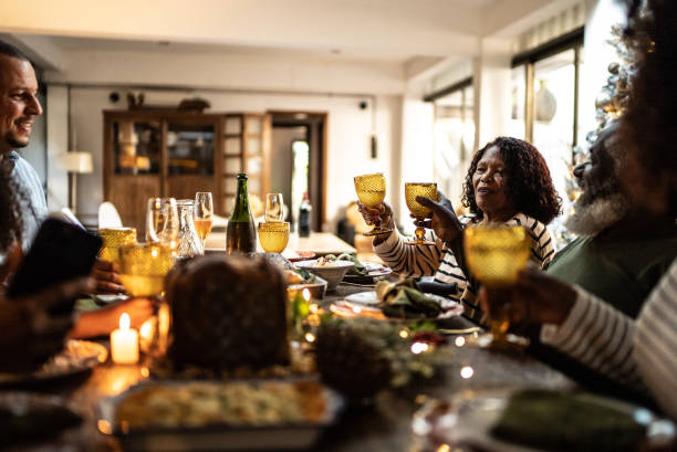 istock Family toasting on Christmas dinner at home 1345495837