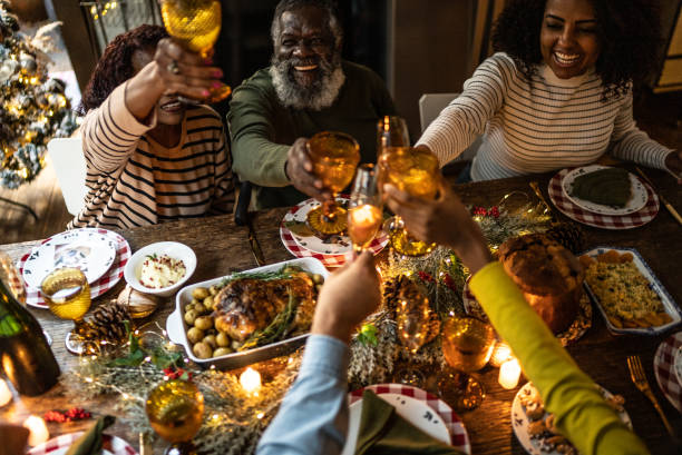 istock Family toasting on Christmas dinner at home 1345495840