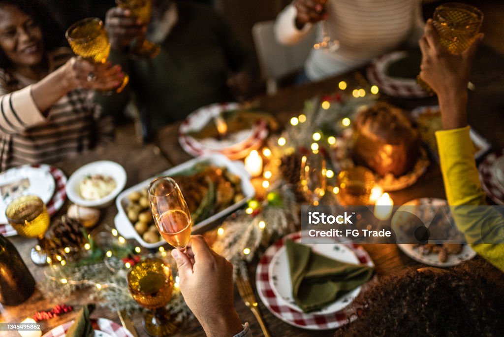 Family toasting on Christmas dinner at home Christmas Stock Photo