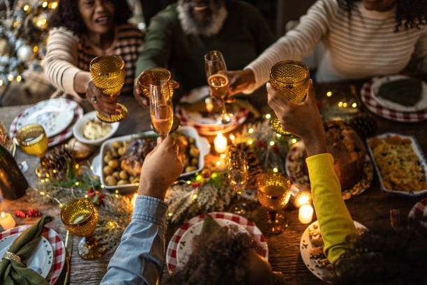 istock Family toasting on Christmas dinner at home 1345495867