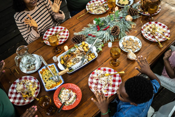 istock Family celebrating on table on Christmas time 1345495905