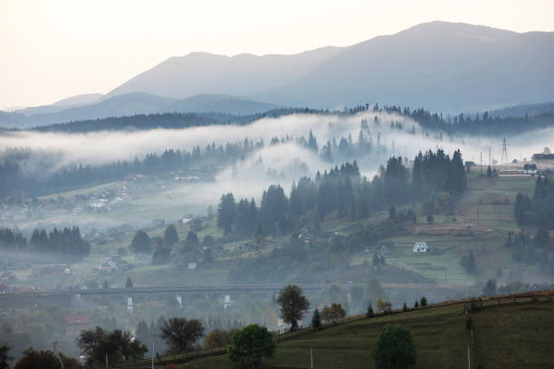 istock Magic dawn in the misty mountains 1345495919