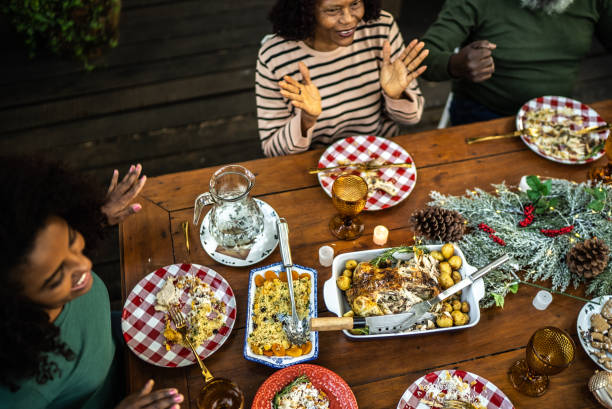 istock Family celebrating on table on Christmas time 1345495924