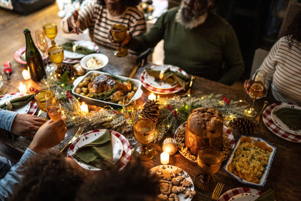 istock Family toasting on Christmas dinner at home 1345495997