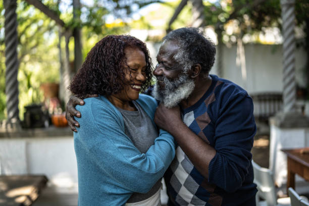 istock Senior couple looking at each other at home 1345496606