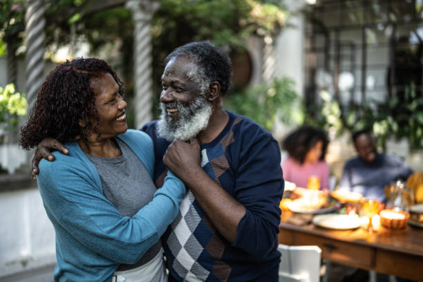 istock Senior couple looking at each other at home 1345496630