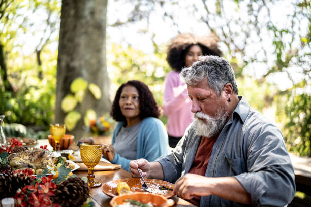 istock Senior couple eating lunch together at home 1345497209
