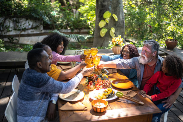 istock Family toasting on Thanksgiving at home 1345497279