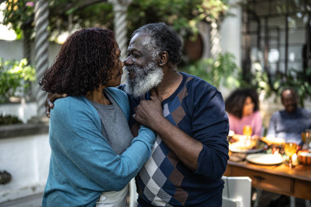 istock Senior couple looking at each other at home 1345497293