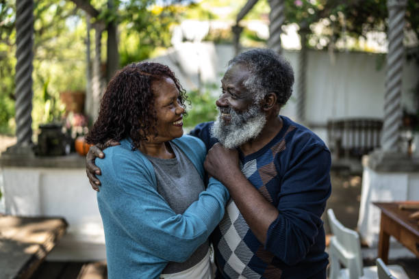 istock Senior couple looking at each other at home 1345497302