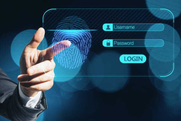 istock Close up of businessman hand using glowing abstract fingerprint interface on blurry blue bokeh circles background. Digital security and information concept. 1345498734