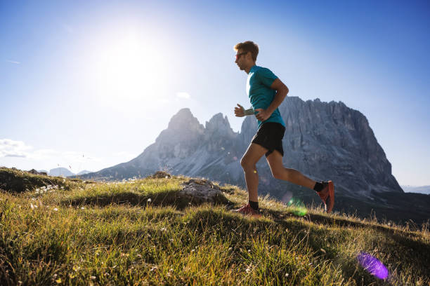 istock Young man trail running on the Dolomites mountain 1345501727