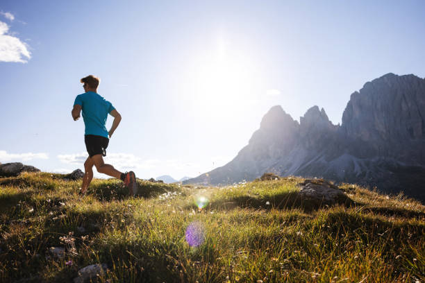 istock Young man trail running on the Dolomites mountain 1345501728