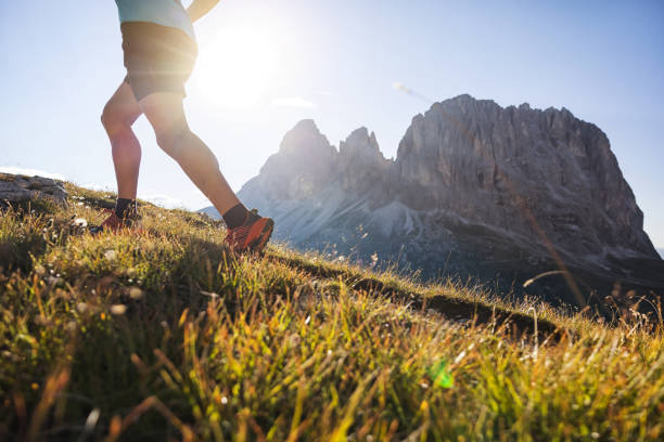 istock Young man trail running on the Dolomites mountain 1345502618