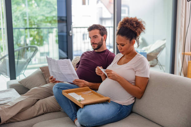 istock Mature Couple Studying the Instructions for a Self-Test for Coronavirus 1345502822