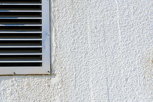 White painted stucco with air vent. Shot with a 35-mm full-frame 61MP Sony A7R IV.