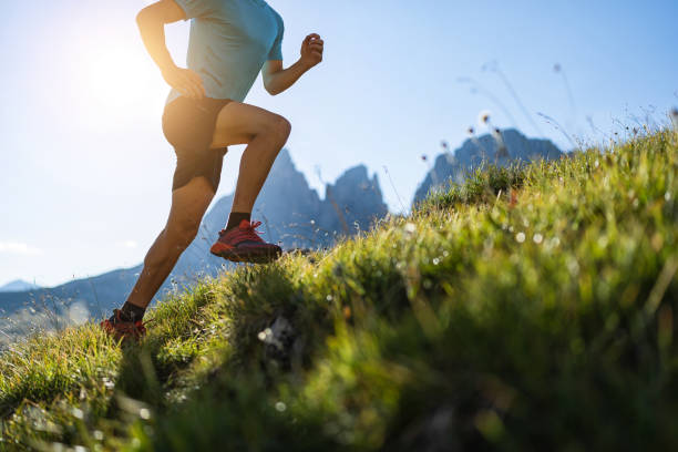 istock Young man trail running on the Dolomites mountain 1345503229