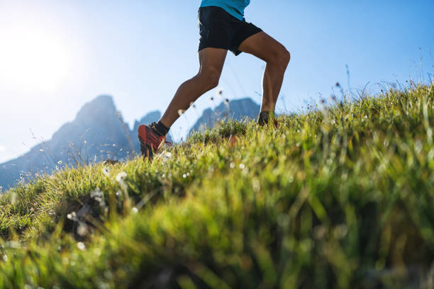 istock Young man trail running on the Dolomites mountain 1345504020
