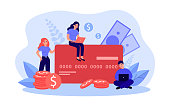 istock Tiny people paying by big credit card 1345504073