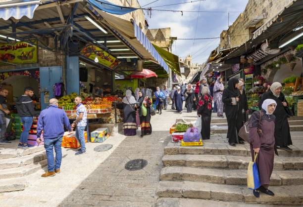Al-Wad Street in the Old City of Jerusalem East Jerusalem, Palestine, May 1, 2019: View of the Al-Wad Street in the Muslim Quarter of the Old City of Jerusalem. east jerusalem stock pictures, royalty-free photos & images