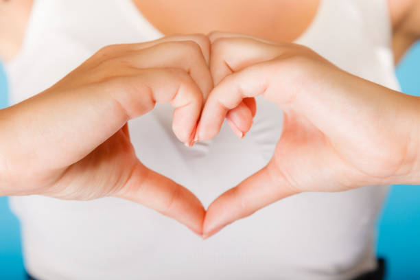 istock Girl hands with heart sign. 1345504591