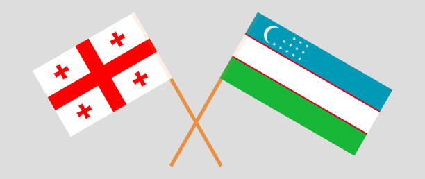 Crossed flags of Georgia and Uzbekistan. Official colors. Correct proportion Crossed flags of Georgia and Uzbekistan. Official colors. Correct proportion. Vector illustration georgia football stock illustrations