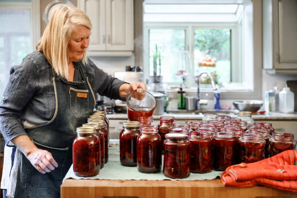 Family preparing preserved beets