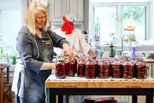 istock Family preparing preserved beets 1345505403