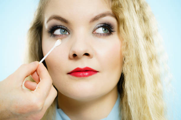 istock Professional artist fixing fashion model make up 1345505494