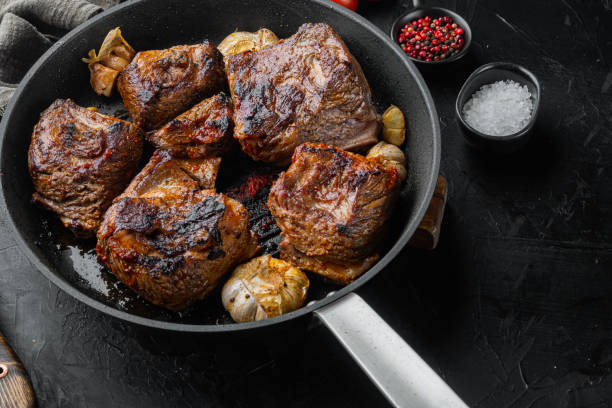 istock Homemade Braised Beef Short Ribs, on black stone background 1345507167