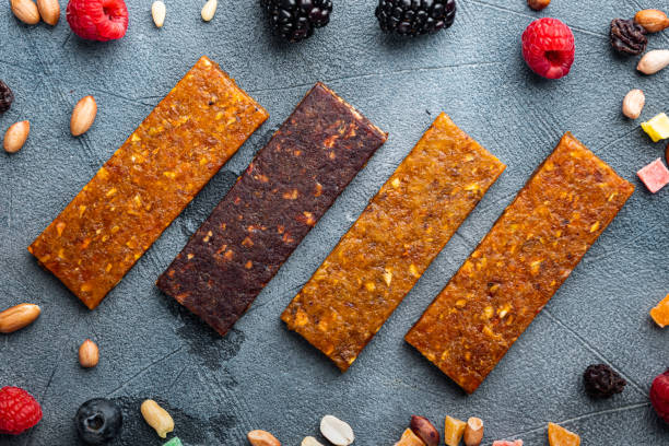 istock Fruit berry and nut energy bars, healthy snack, flat lay, on grey background 1345507277