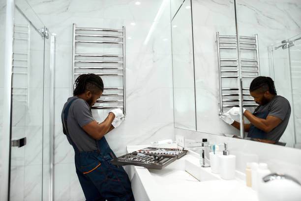 istock Strong and handsome plumber fixing towel rail 1345507287