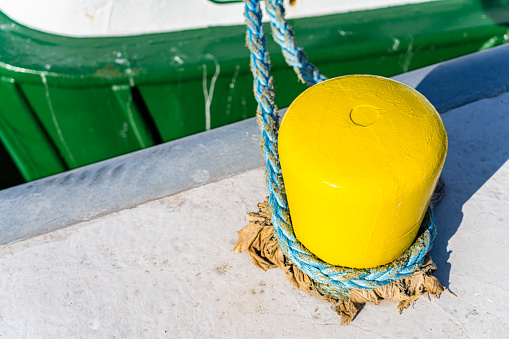 Ship docked to yellow bollard with rope. Shot with a 35-mm full-frame 61MP Sony A7R IV.