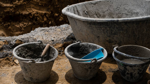 istock 4 cement buckets on the floor for a construction industry business idea. 1345510140