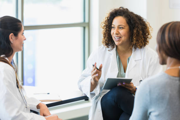 istock Three female doctors meet together 1345513648