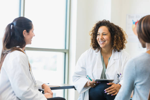 istock Female doctors enjoy meeting together 1345513654
