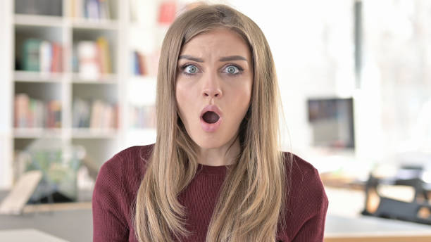 istock Shocked Young Woman Wondering in Awe 1345513694