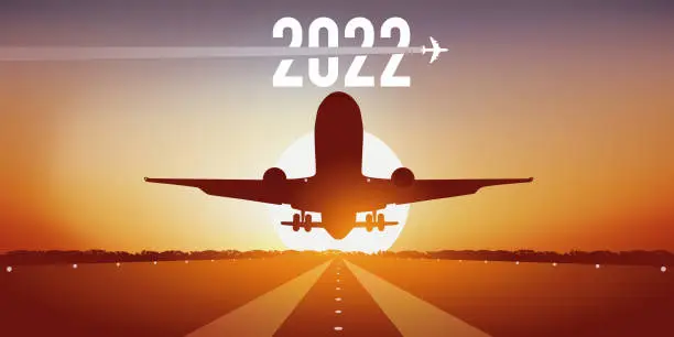 Vector illustration of Greeting card 2022 with a plane landing at sunset.